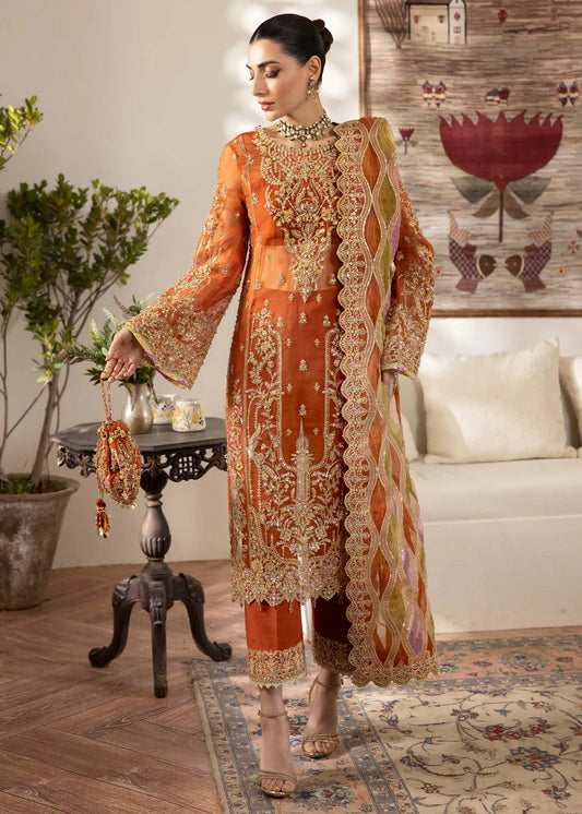 Model wearing burnt orange Roshail dress by Kanwal Malik with detailed embroidery—Pakistani luxury pret available online in UK.