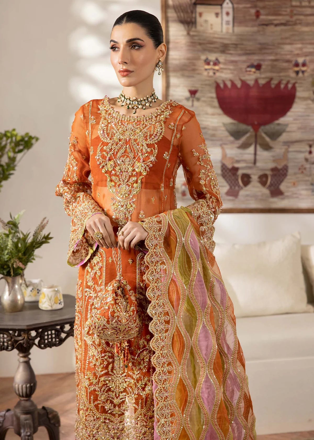 Model wearing burnt orange Roshail dress by Kanwal Malik with detailed embroidery—Pakistani luxury pret available online in UK.