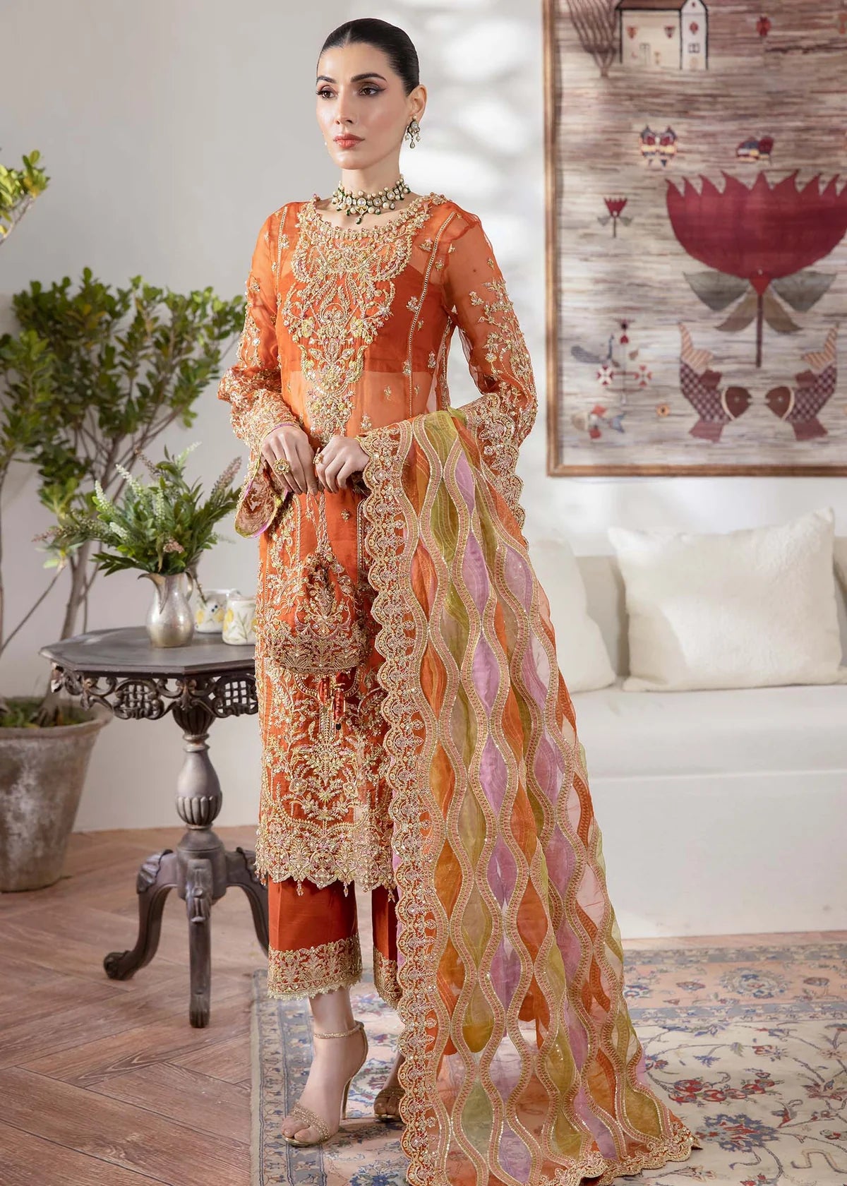 Model wearing burnt orange Roshail dress by Kanwal Malik with detailed embroidery—Pakistani luxury pret available online in UK.