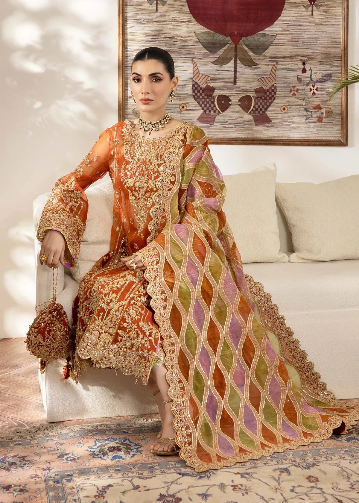 Model wearing burnt orange Roshail dress by Kanwal Malik with detailed embroidery—Pakistani luxury pret available online in UK.