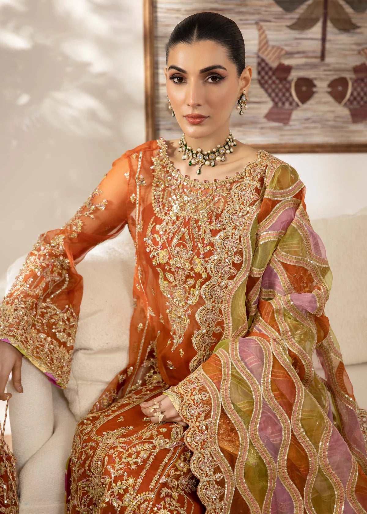 Model wearing burnt orange Roshail dress by Kanwal Malik with detailed embroidery—Pakistani luxury pret available online in UK.