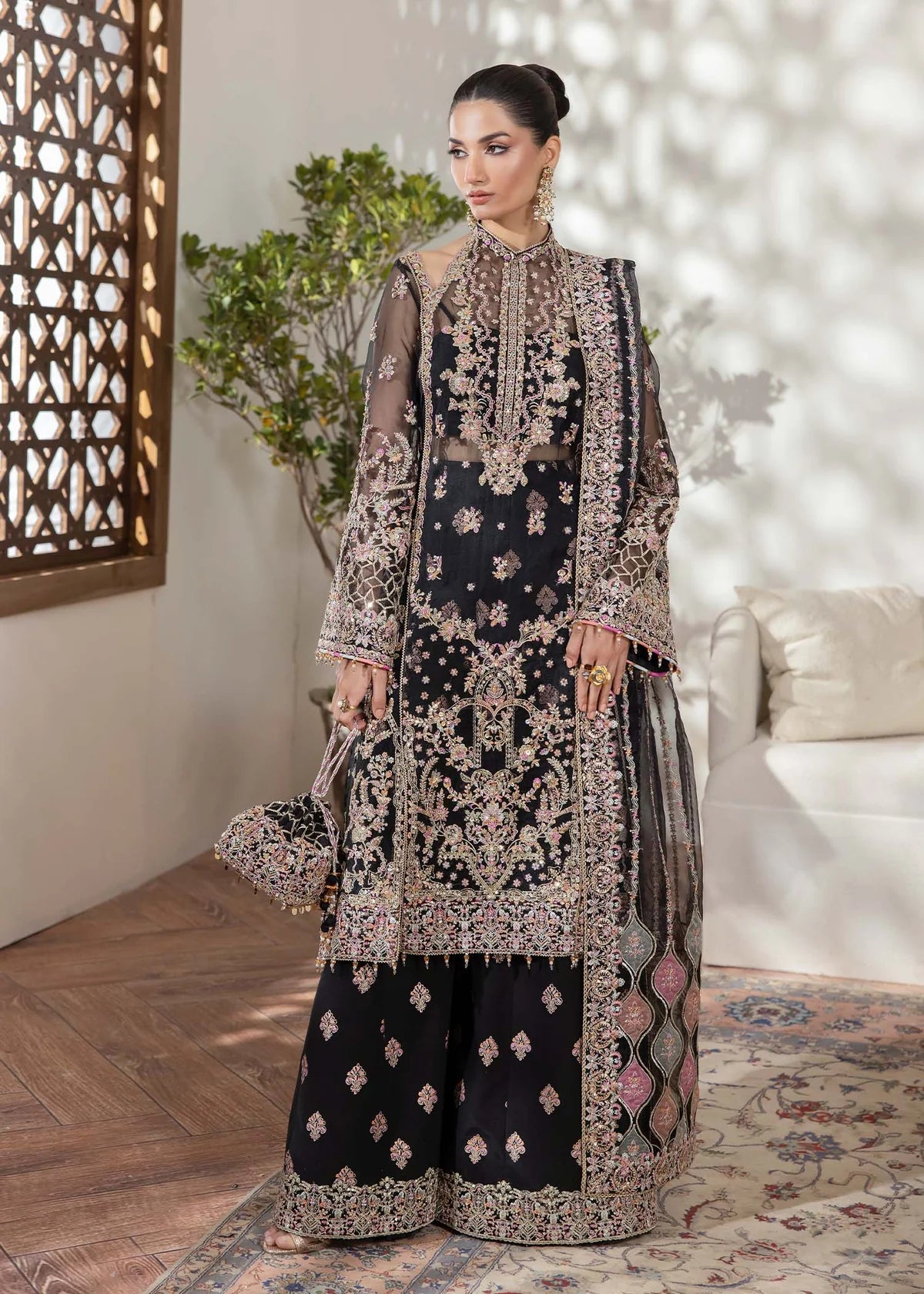 Model wearing black Rama outfit from Kanwal Malik with intricate embroidery—Pakistani luxury pret available online in UK.