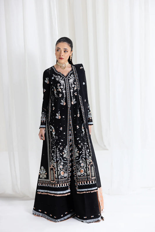 Model wearing black Qalamkar SB-03 Misha embroidered suit with peach accents, ideal for Eid and Pakistani luxury pret online in UK.