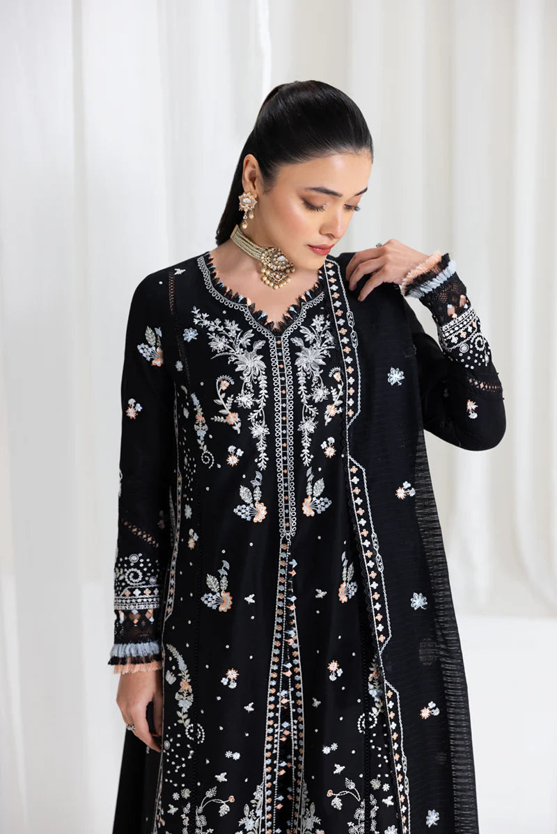 Model wearing black Qalamkar SB-03 Misha embroidered suit with peach accents, ideal for Eid and Pakistani luxury pret online in UK.