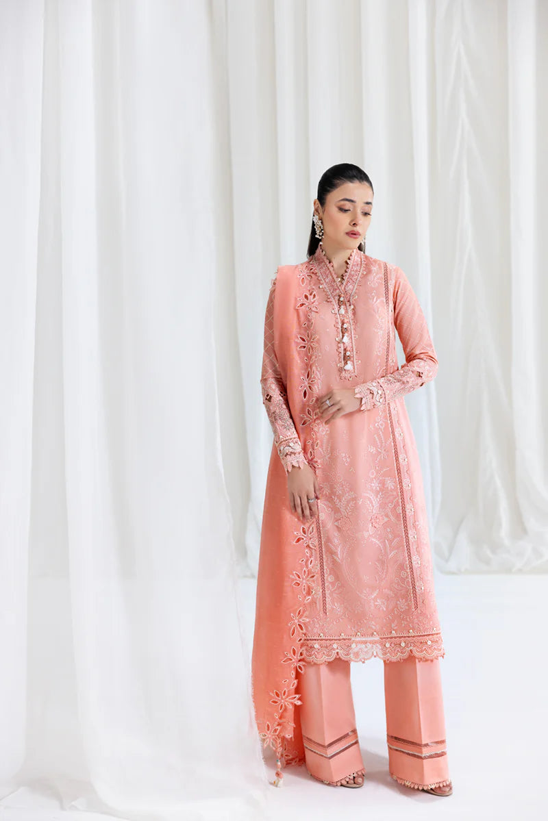Model wearing peach Qalamkar SB-12 Jafa suit with delicate embroidery, perfect for Pakistani luxury pret and Eid outfits online in UK.