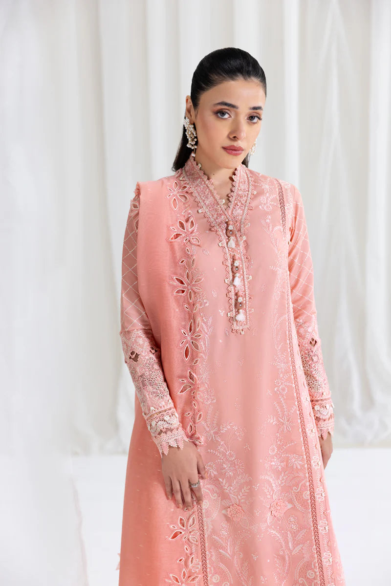 Model wearing peach Qalamkar SB-12 Jafa suit with delicate embroidery, perfect for Pakistani luxury pret and Eid outfits online in UK.