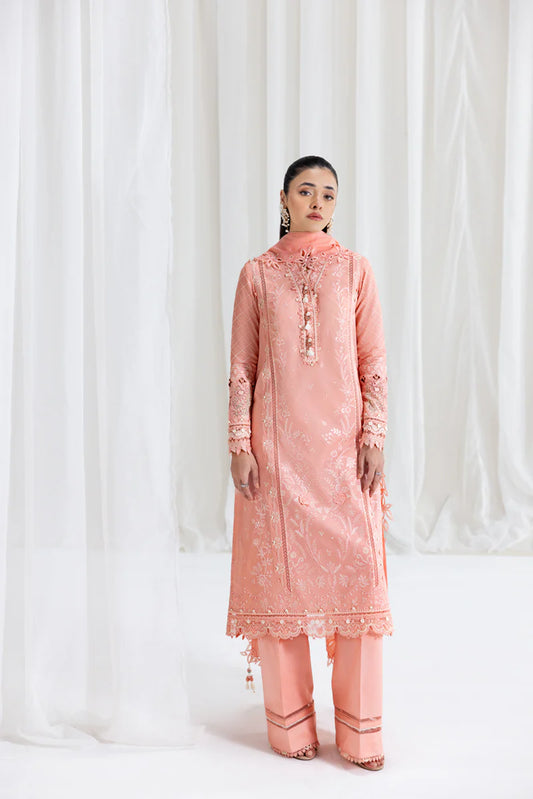 Model wearing peach Qalamkar SB-12 Jafa suit with delicate embroidery, perfect for Pakistani luxury pret and Eid outfits online in UK.
