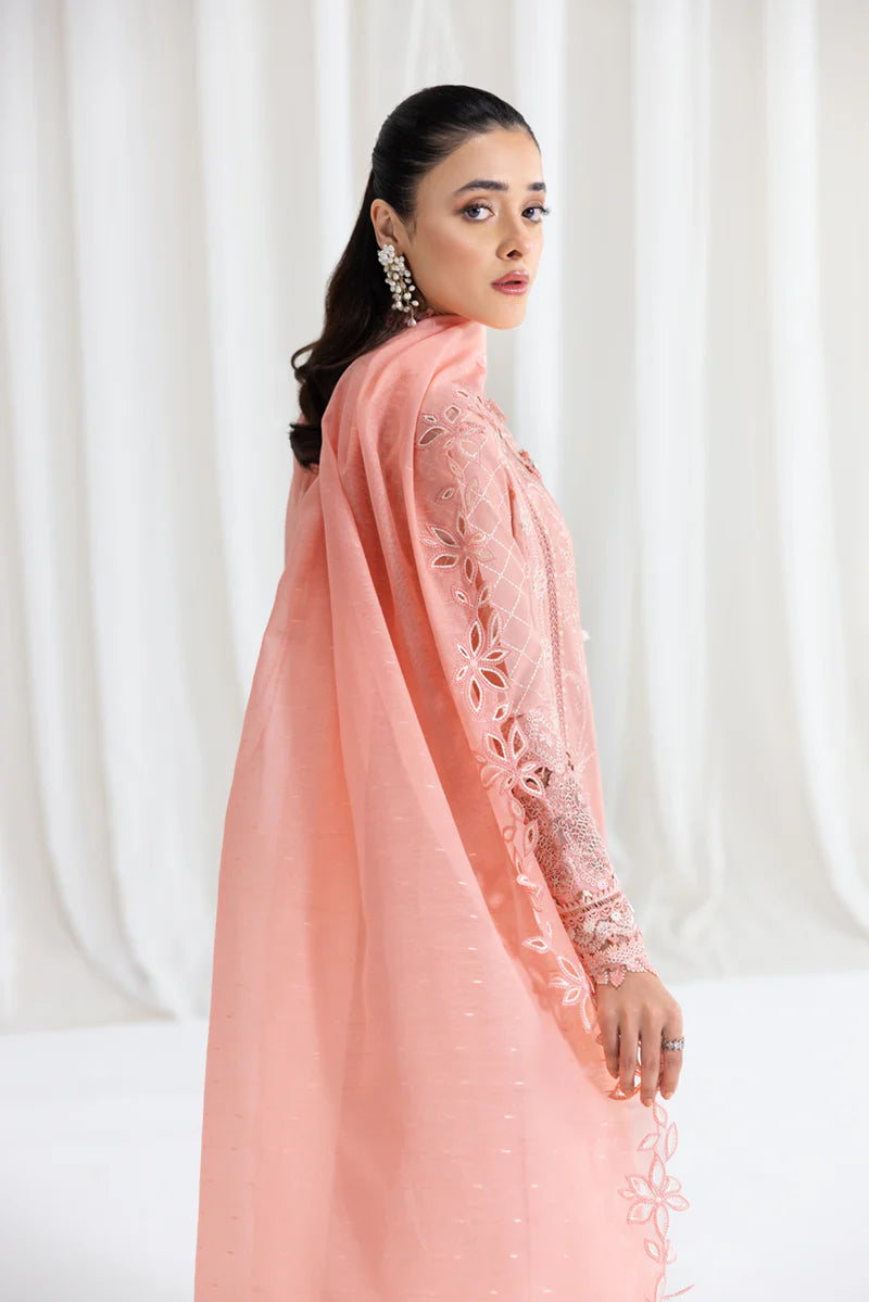 Model wearing peach Qalamkar SB-12 Jafa suit with delicate embroidery, perfect for Pakistani luxury pret and Eid outfits online in UK.