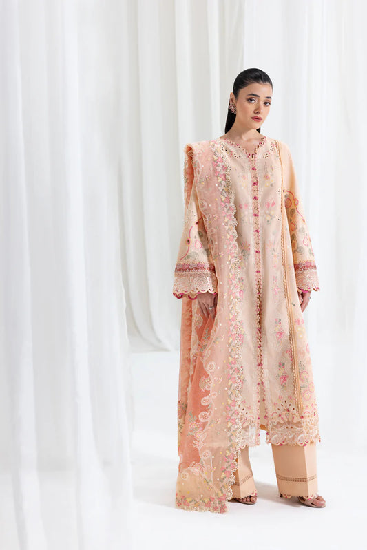 Model wearing peach Qalamkar SB-07 Zoya embroidered suit with floral detailing, perfect for Eid and Pakistani luxury pret online in UK.
