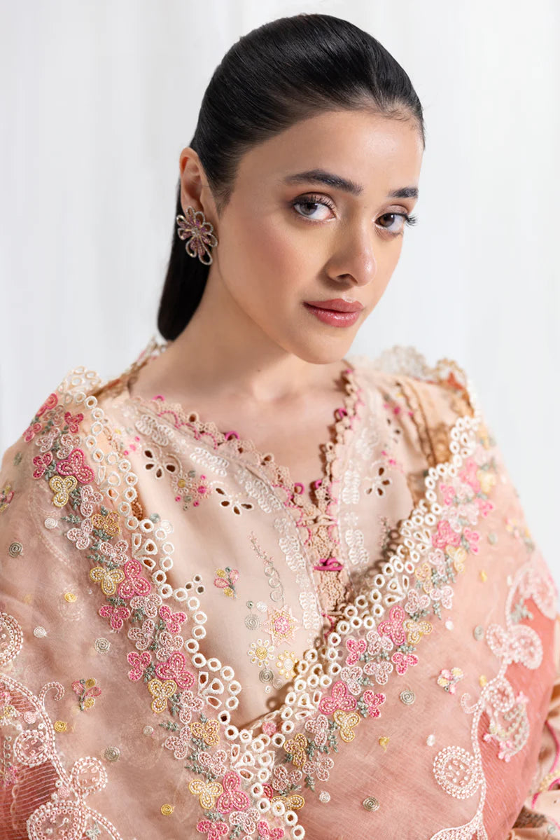Model wearing peach Qalamkar SB-07 Zoya embroidered suit with floral detailing, perfect for Eid and Pakistani luxury pret online in UK.