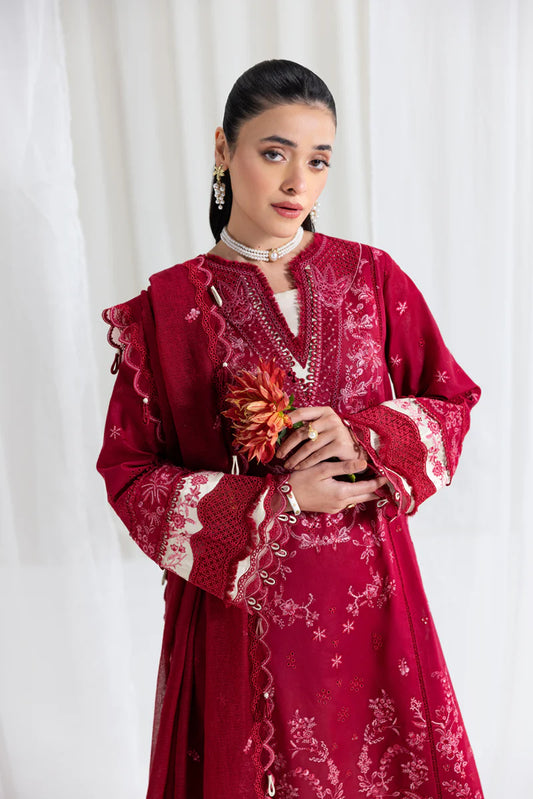 Model wearing maroon Qalamkar SB-02 Sameen embroidered outfit, ideal for Eid festivities and Pakistani luxury pret online in UK.