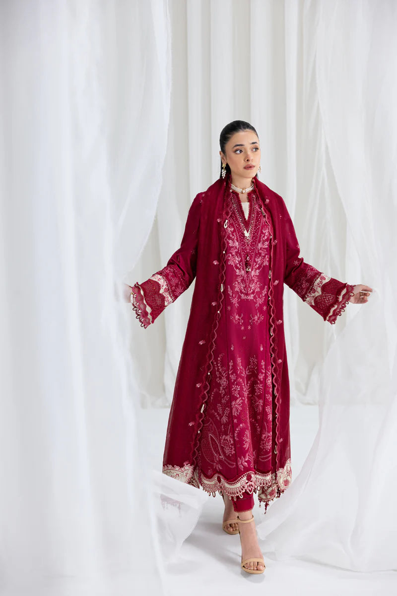 Model wearing maroon Qalamkar SB-02 Sameen embroidered outfit, ideal for Eid festivities and Pakistani luxury pret online in UK.