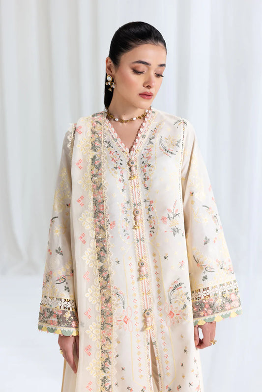 Model wearing ivory Qalamkar SB-01 Rina embroidered suit with pastel floral detailing, perfect for Eid and Pakistani luxury pret in UK.