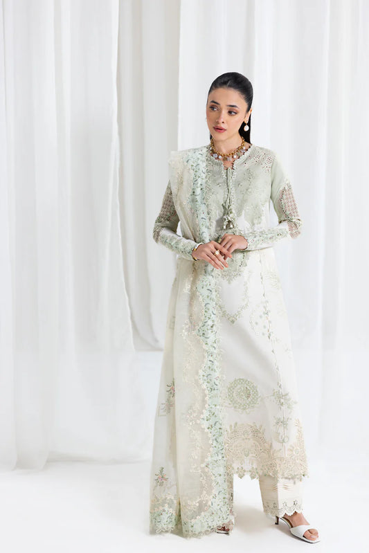 Model wearing pistachio green Qalamkar SB-10 Nadia embroidered outfit, perfect for Eid and Pakistani luxury pret clothes online in UK.