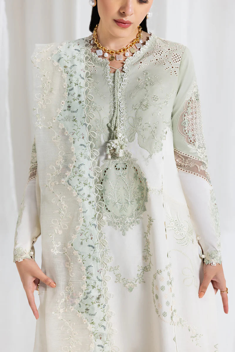 Model wearing pistachio green Qalamkar SB-10 Nadia embroidered outfit, perfect for Eid and Pakistani luxury pret clothes online in UK.