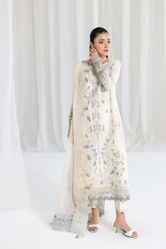 Model wearing ivory Qalamkar SB-09 Adeena embroidered outfit with sky blue accents, perfect for Eid and Pakistani luxury pret online in UK.