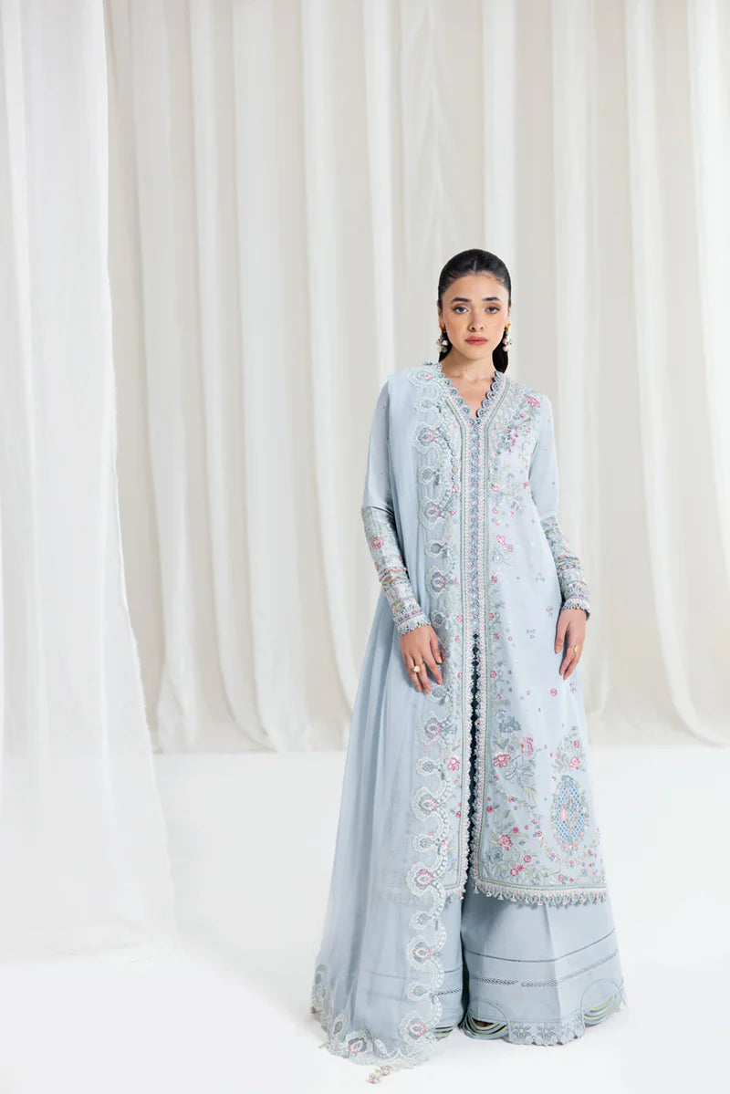 Model wearing pastel blue Qalamkar SB-04 Zarish embroidered outfit, ideal for Eid celebrations and Pakistani luxury pret online in UK.