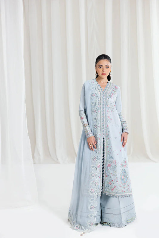 Model wearing pastel blue Qalamkar SB-04 Zarish embroidered outfit, ideal for Eid celebrations and Pakistani luxury pret online in UK.