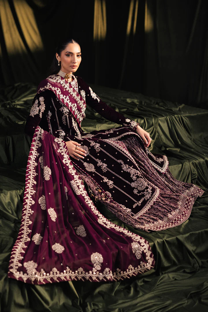 Model wearing Qalamkar Velvet Edit '24 BK-01 AMANI, a rich maroon velvet dress with intricate embroidery, ideal for weddings. Available as Pakistani clothes online in the UK.