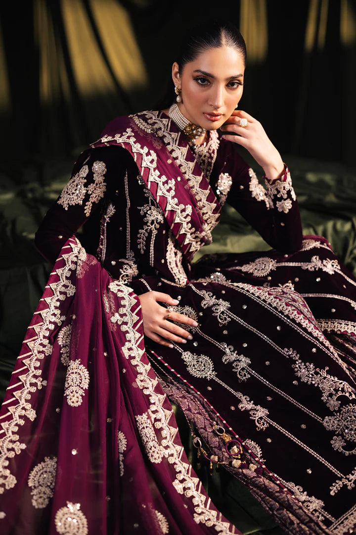 Model wearing Qalamkar Velvet Edit '24 BK-01 AMANI, a rich maroon velvet dress with intricate embroidery, ideal for weddings. Available as Pakistani clothes online in the UK.