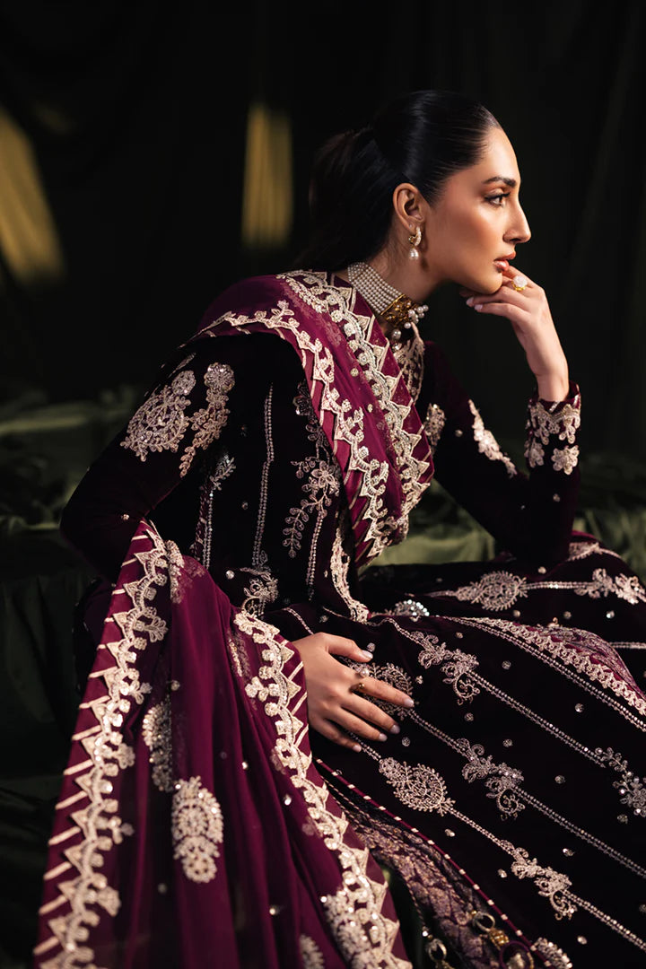 Model wearing Qalamkar Velvet Edit '24 BK-01 AMANI, a rich maroon velvet dress with intricate embroidery, ideal for weddings. Available as Pakistani clothes online in the UK.