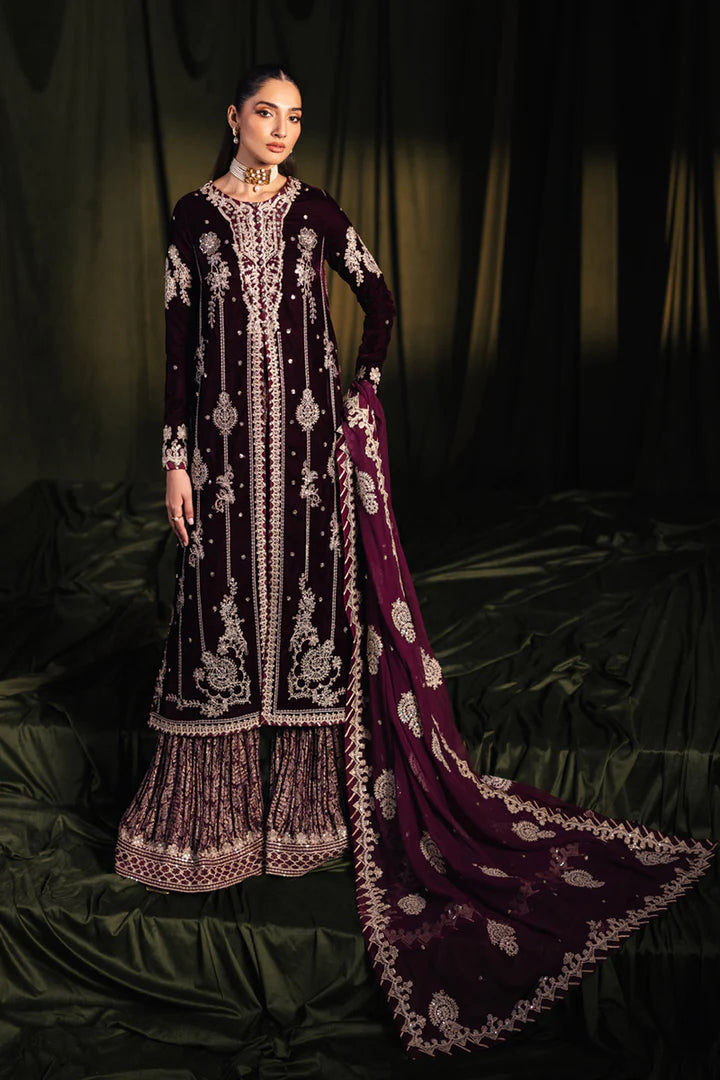 Model wearing Qalamkar Velvet Edit '24 BK-01 AMANI, a rich maroon velvet dress with intricate embroidery, ideal for weddings. Available as Pakistani clothes online in the UK.