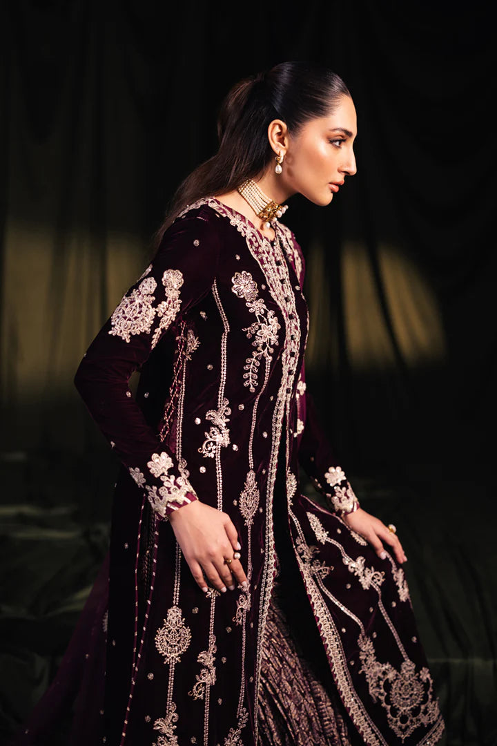 Model wearing Qalamkar Velvet Edit '24 BK-01 AMANI, a rich maroon velvet dress with intricate embroidery, ideal for weddings. Available as Pakistani clothes online in the UK.