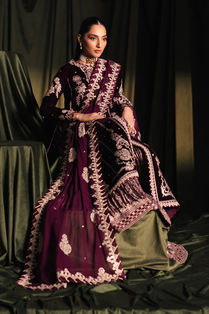 Model wearing Qalamkar Velvet Edit '24 BK-01 AMANI, a rich maroon velvet dress with intricate embroidery, ideal for weddings. Available as Pakistani clothes online in the UK.