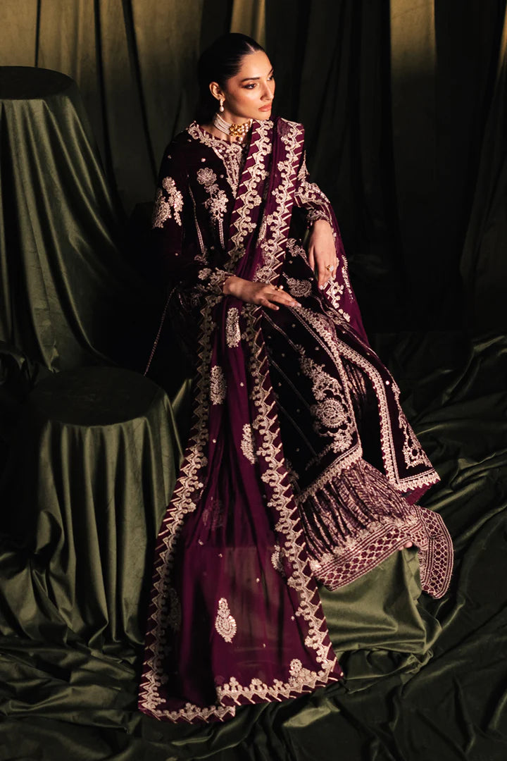 Model wearing Qalamkar Velvet Edit '24 BK-01 AMANI, a rich maroon velvet dress with intricate embroidery, ideal for weddings. Available as Pakistani clothes online in the UK.