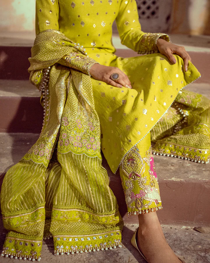 model wearing lime green dress by Faiza Saqlain, Pakistani luxury pret available online in UK for festive celebrations