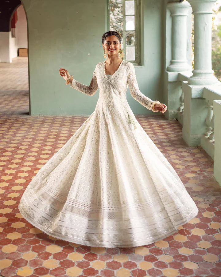 model wearing white dress with colorful dupatta by Faiza Saqlain, Pakistani luxury pret available online in UK