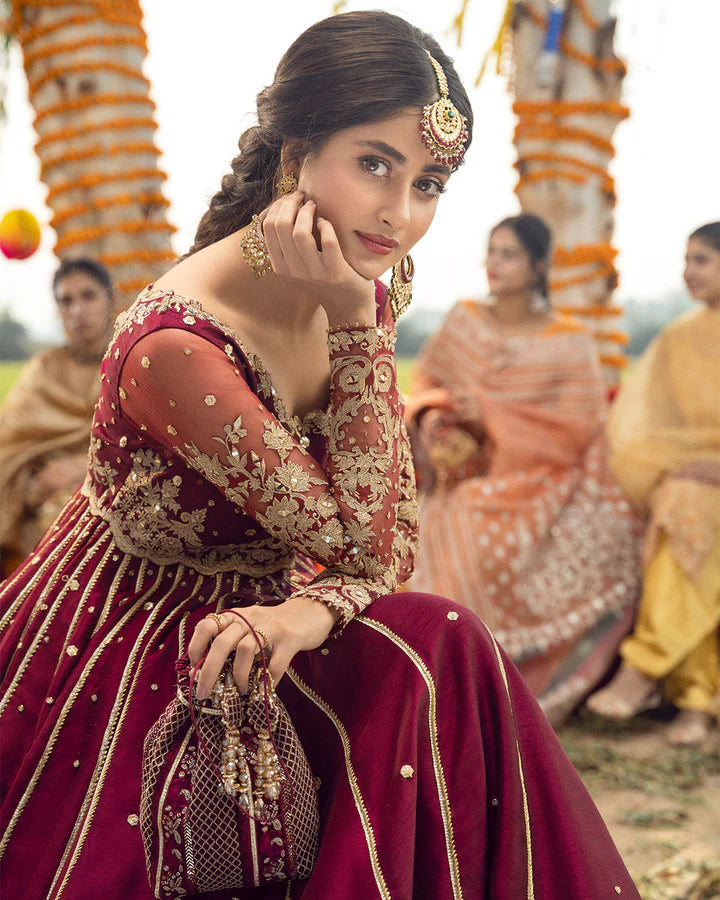 model wearing maroon dress by Faiza Saqlain, Pakistani luxury pret available online in UK for elegant festive wear