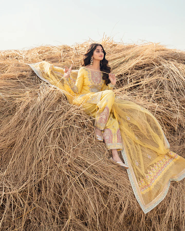 model wearing yellow dress by Faiza Saqlain, Pakistani luxury pret ideal for online shopping in the UK