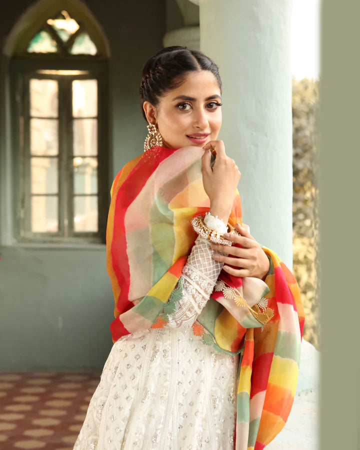 model wearing white dress with colorful dupatta by Faiza Saqlain, Pakistani luxury pret available online in UK