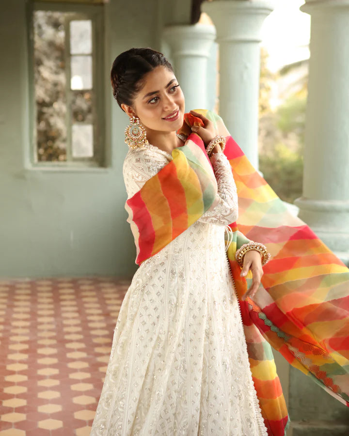 model wearing white dress with colorful dupatta by Faiza Saqlain, Pakistani luxury pret available online in UK