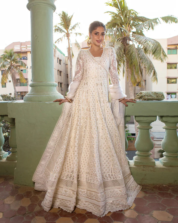 model wearing white dress with colorful dupatta by Faiza Saqlain, Pakistani luxury pret available online in UK