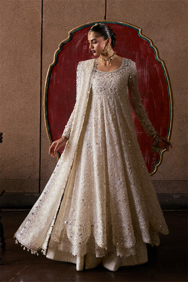Model wearing ivory embellished gown from Suffuse Zahrell, Pakistani luxury pret, shop elegant Pakistani clothes online in UK
