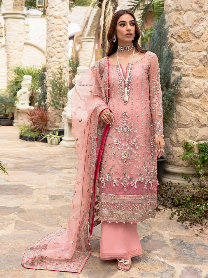 Model wearing soft pink Aethira GL-LP-V1-01 from Gulaal, featuring detailed embellishments—Pakistani luxury pret clothes online in UK.