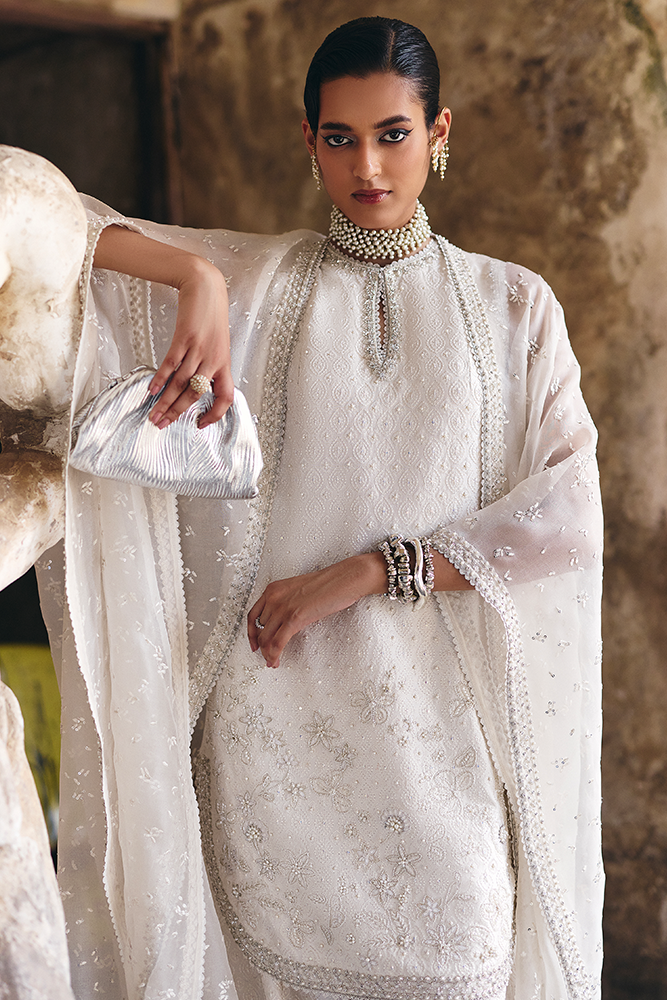 Model wearing ELUNA, back view, a Pakistani designer outfit by Suffuse, available online in the UK.