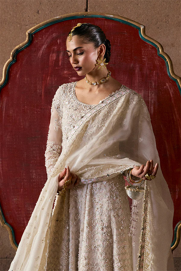 Model wearing ivory embellished gown from Suffuse Zahrell, Pakistani luxury pret, shop elegant Pakistani clothes online in UK
