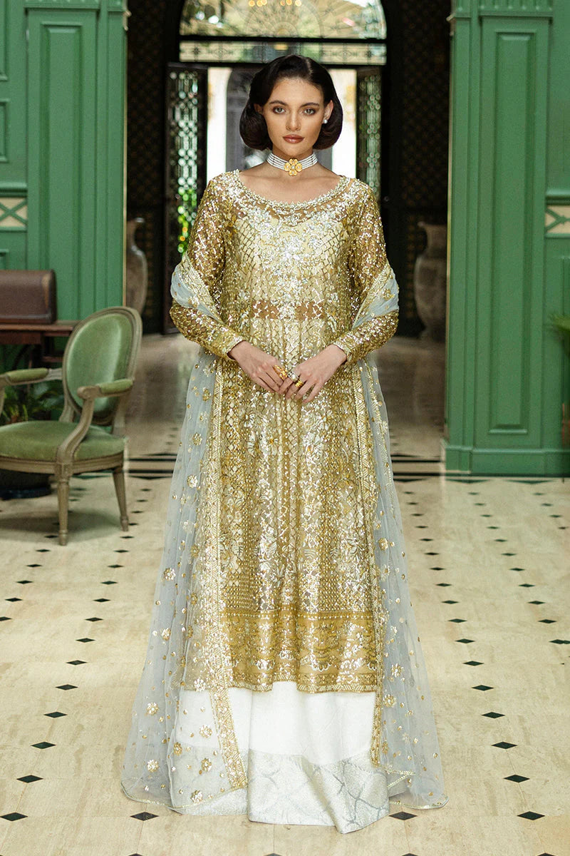 Model wearing gold and silver embellished dress from Mushq Only You, Pakistani luxury pret ideal for weddings, shop online in UK
