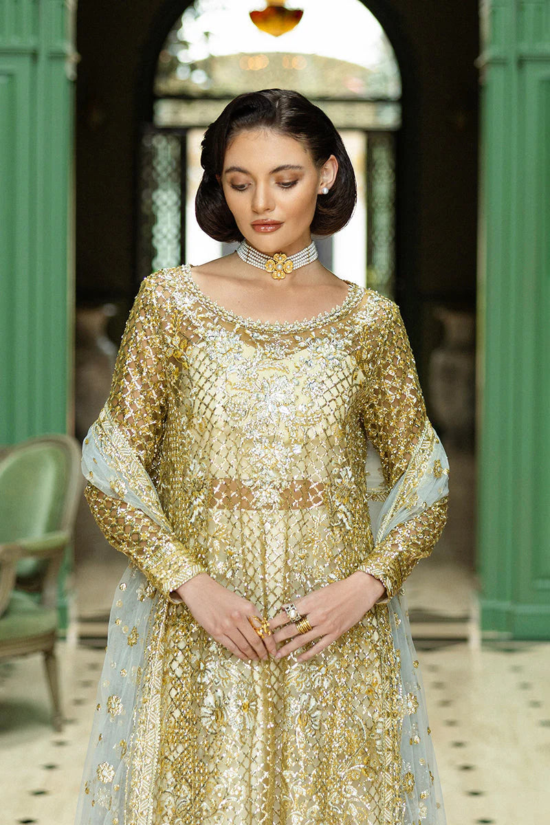 Model wearing gold and silver embellished dress from Mushq Only You, Pakistani luxury pret ideal for weddings, shop online in UK
