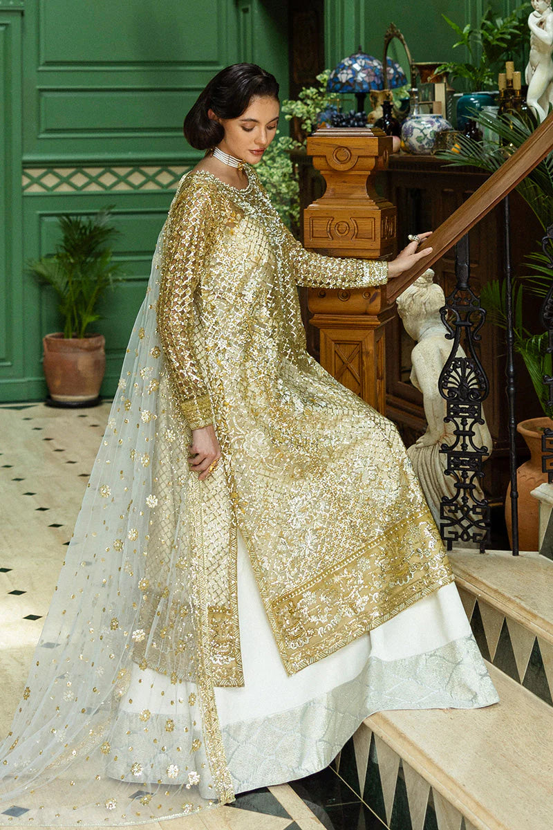 Model wearing gold and silver embellished dress from Mushq Only You, Pakistani luxury pret ideal for weddings, shop online in UK
