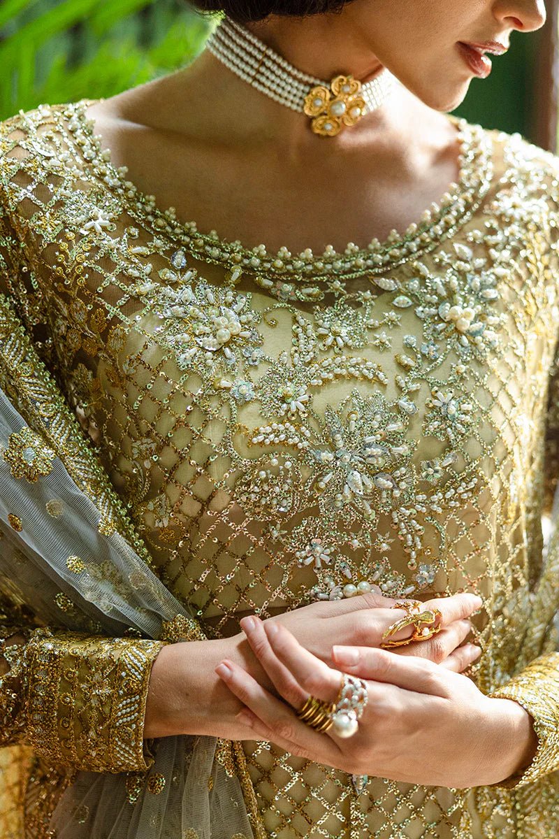 Model wearing gold and silver embellished dress from Mushq Only You, Pakistani luxury pret ideal for weddings, shop online in UK
