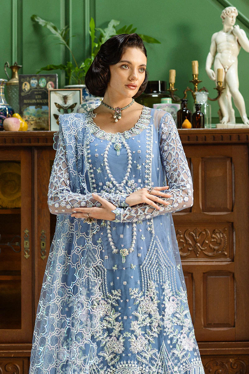 Model wearing powder blue embroidered dress from Mushq Before the Rain, Pakistani luxury pret, shop Pakistani clothes online in UK
