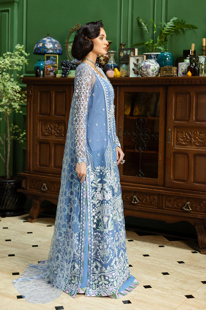 Model wearing powder blue embroidered dress from Mushq Before the Rain, Pakistani luxury pret, shop Pakistani clothes online in UK
