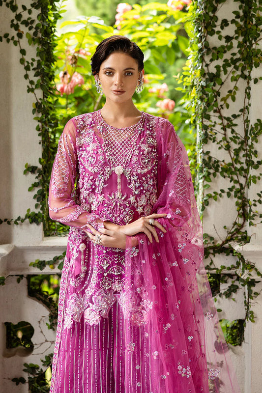 Model wearing deep pink embellished dress from Mushq Sweet November, Pakistani luxury pret for festive events, shop online in UK
