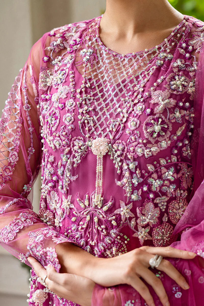 Model wearing deep pink embellished dress from Mushq Sweet November, Pakistani luxury pret for festive events, shop online in UK
