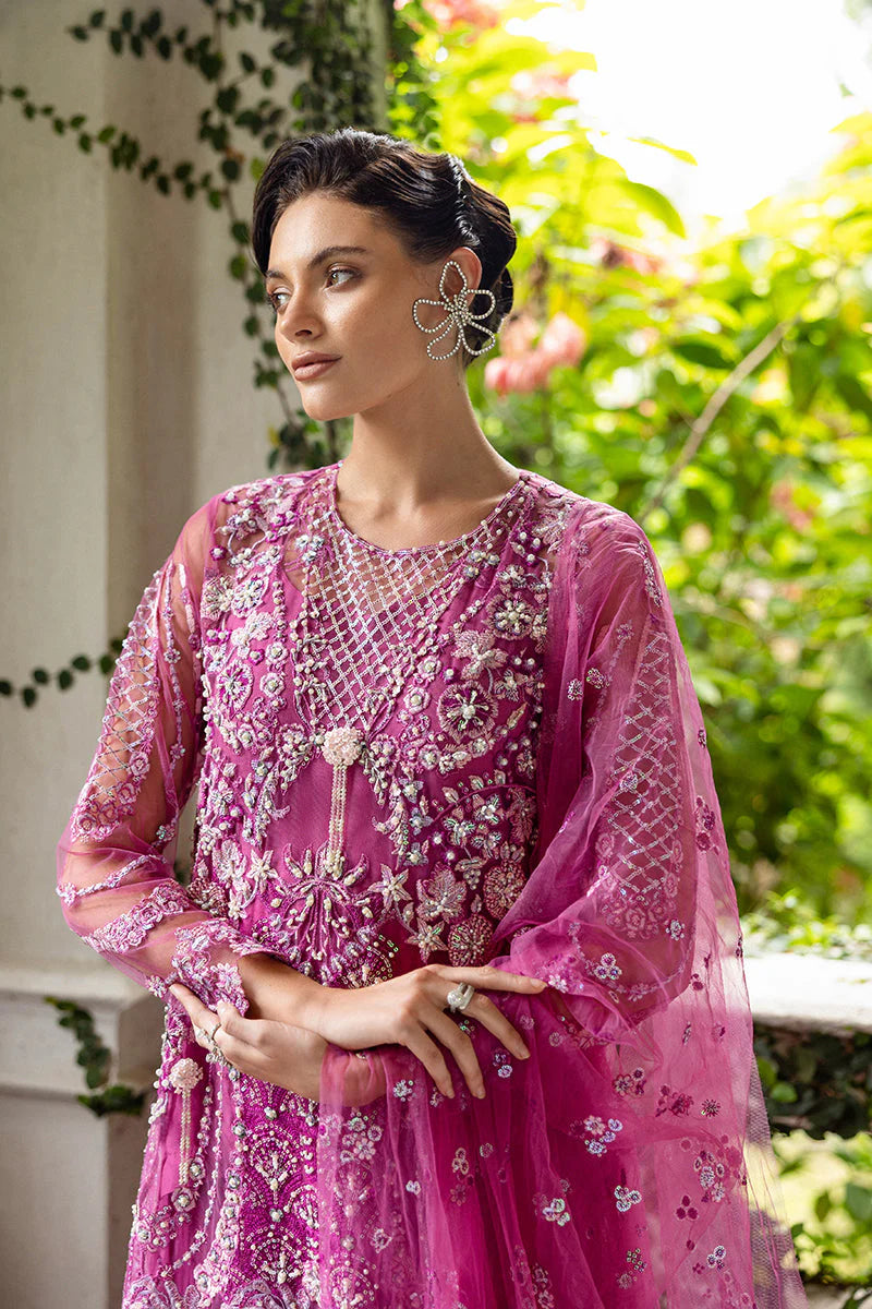 Model wearing deep pink embellished dress from Mushq Sweet November, Pakistani luxury pret for festive events, shop online in UK
