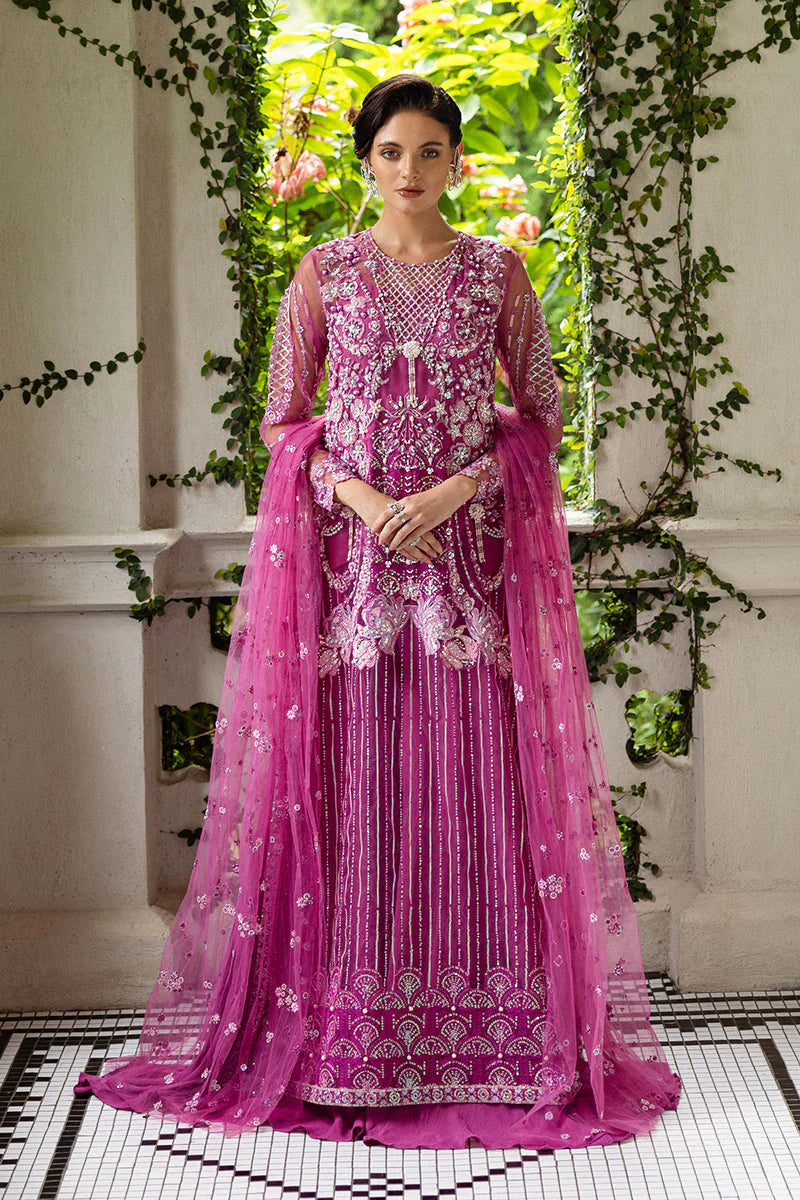 Model wearing deep pink embellished dress from Mushq Sweet November, Pakistani luxury pret for festive events, shop online in UK
